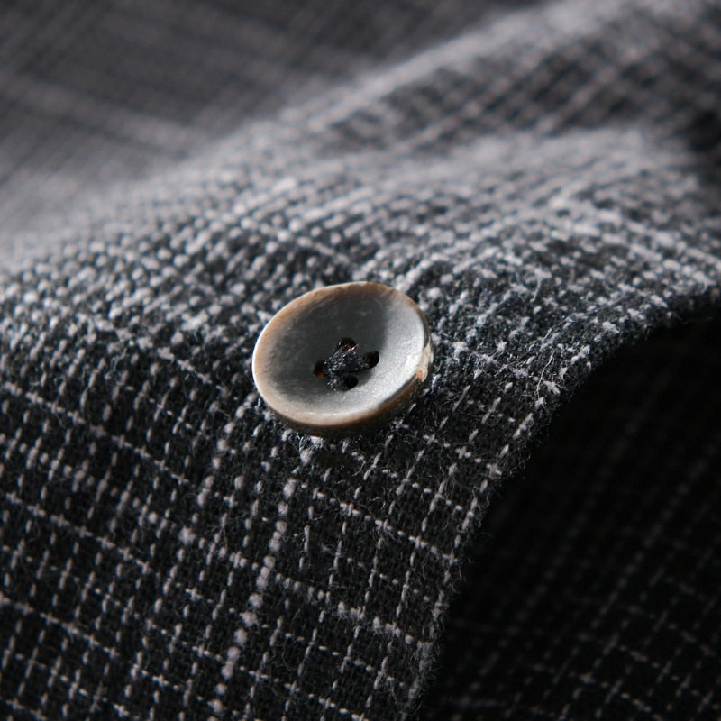 Close-up of button detail on designer long sleeve Italy brand casual 100% cotton shirt for men.