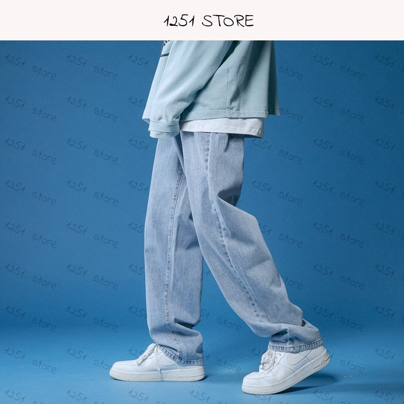 Wide straight jeans for men and women, white loose denim trousers, casual streetwear style.