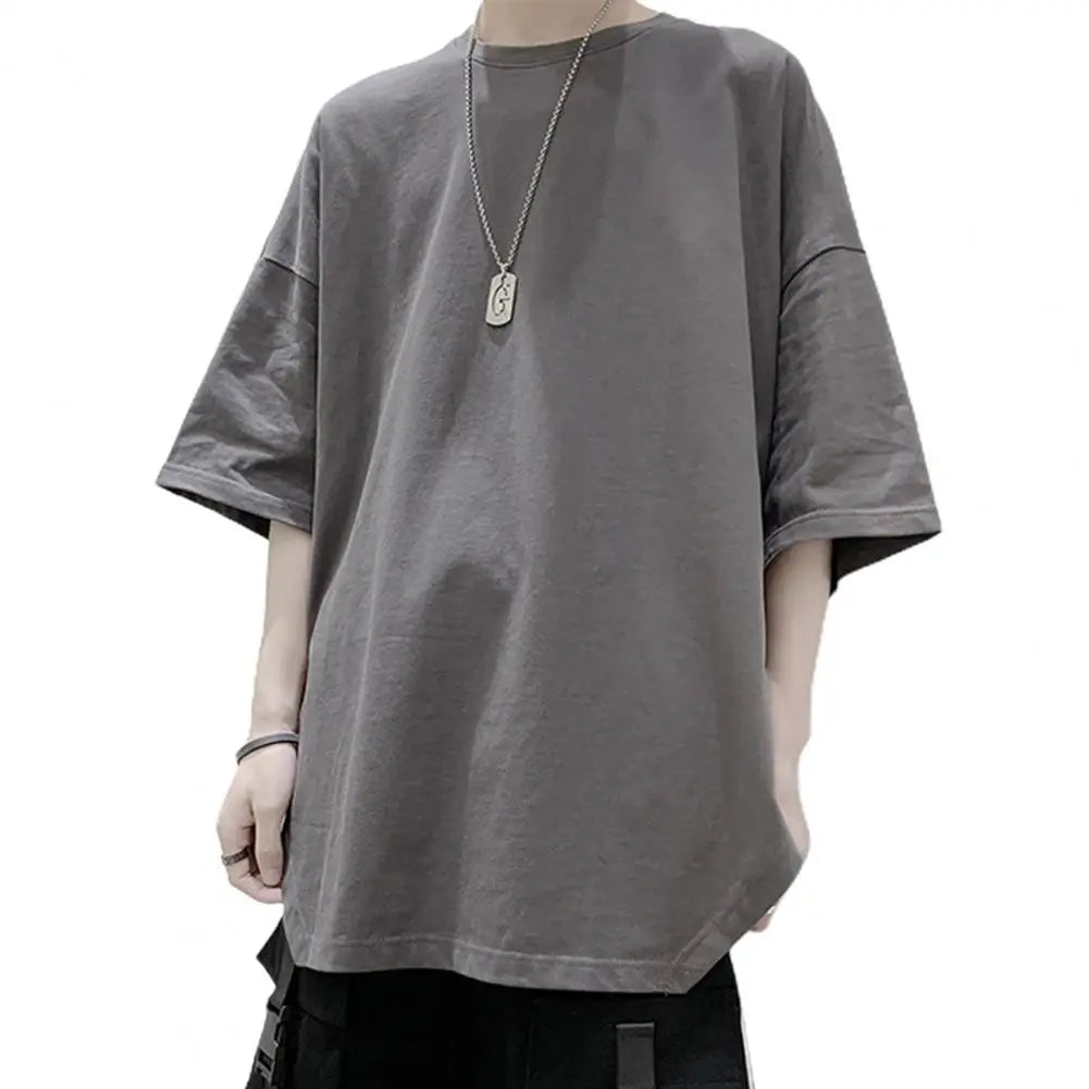 Men's Harajuku half sleeve oversized t-shirt with round neck and side split; solid color, simple daily tee.