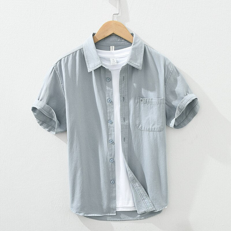 Men's yellow short sleeve cotton shirt with button-up design and patch pockets, ideal for casual summer wear.