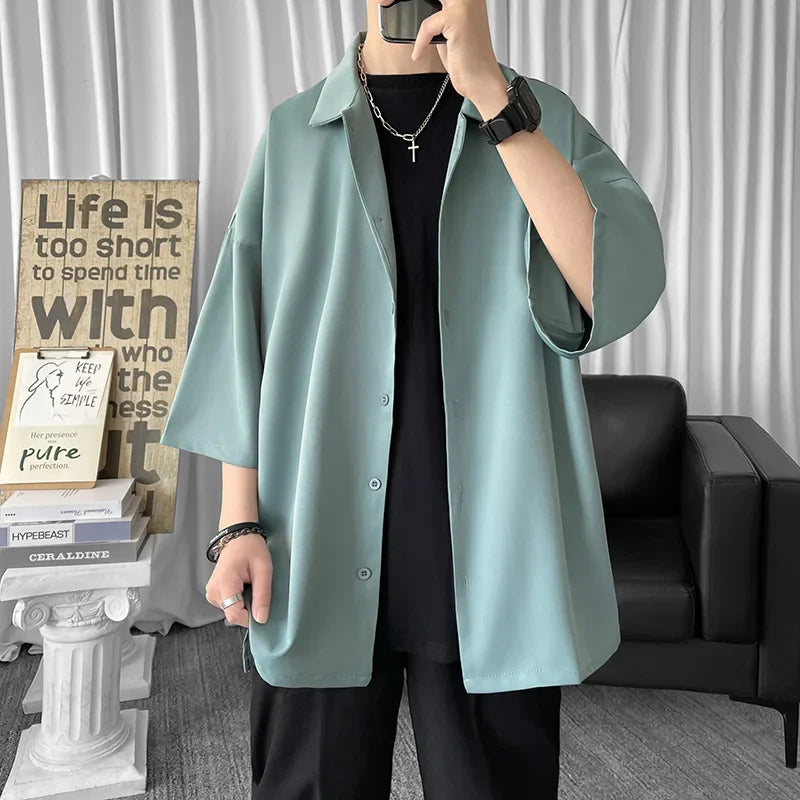 Solid color oversized men's casual half sleeve shirt in light teal, Harajuku summer streetwear style, 2021.