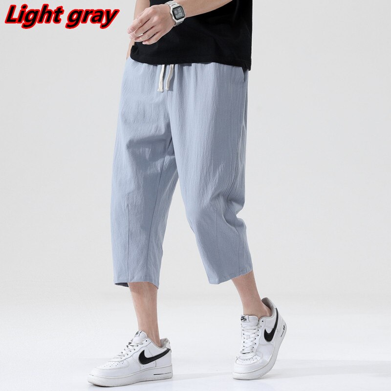 Light gray men's linen pants, casual Korean style, mid-waist, drawstring closure.