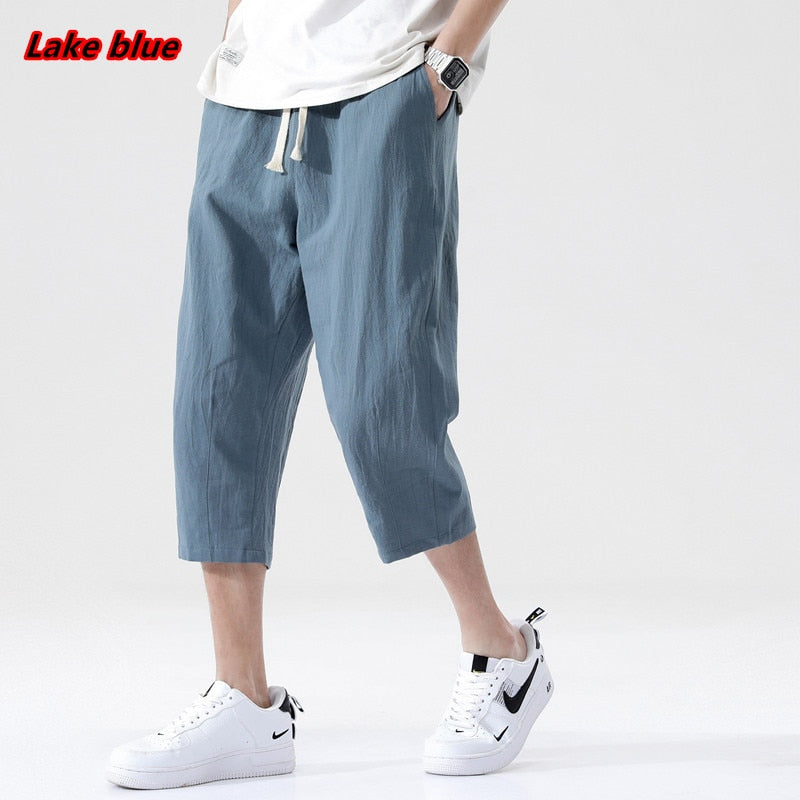 Men's lake blue linen loose pants, Korean style, nine-point length, casual summer fashion.