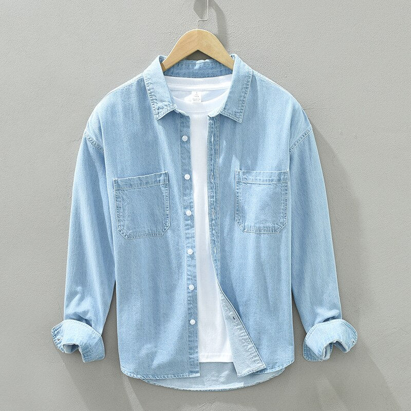 Spring autumn men's long sleeve denim shirt, soft 100% cotton, blue color, casual style with two pockets and button closure.