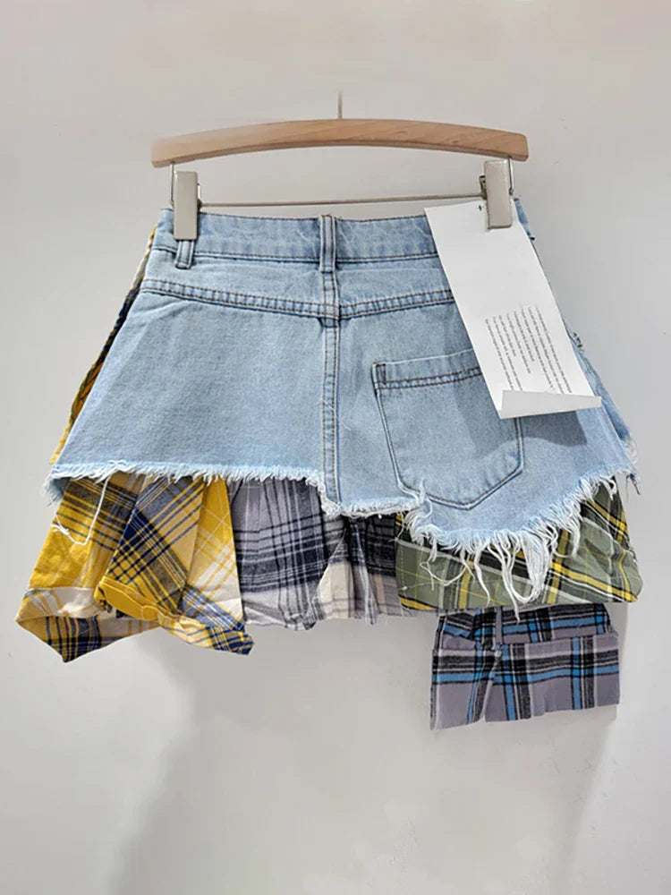 Women's high-waist mini denim skirt with colored plaid patchwork and irregular deconstructed design.