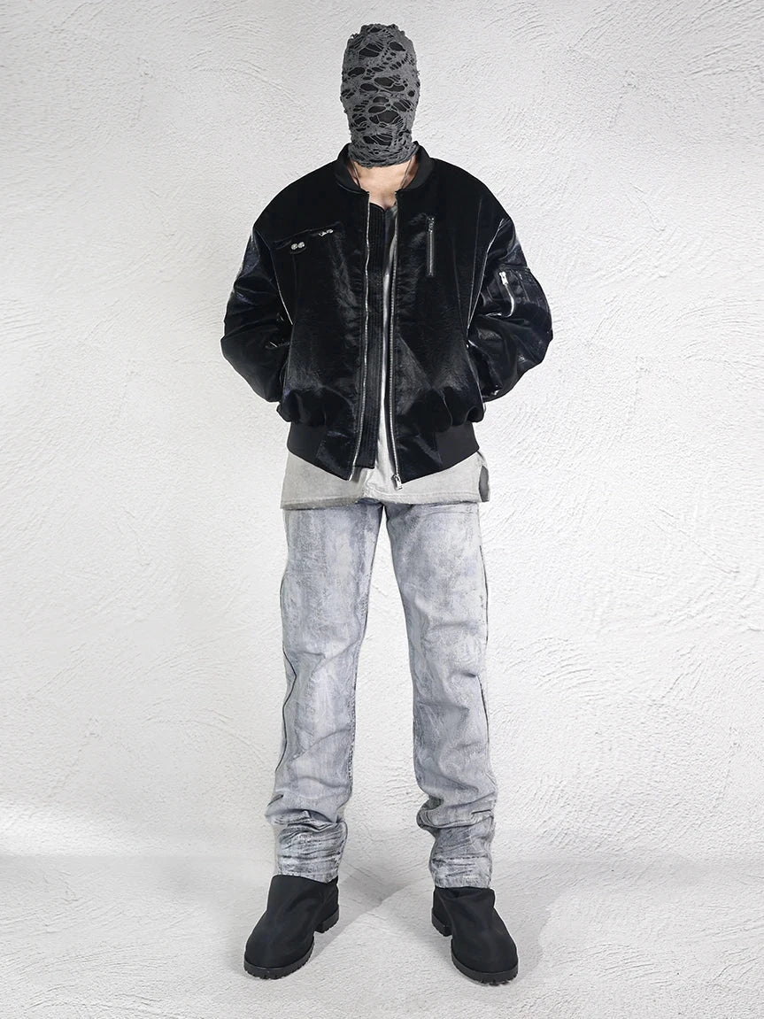 Men's punk style distressed cargo jeans with white paint coating, gray and white washed, paired with a black jacket and mask.