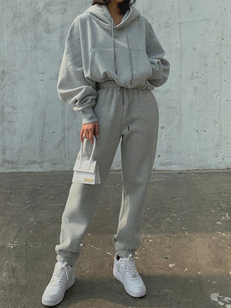 Women's casual fleece tracksuit set with hooded pullover and sweatpants, solid color, perfect for winter and spring sports.