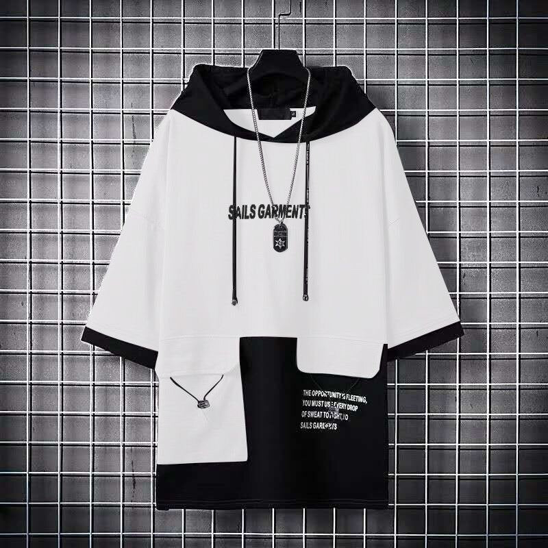 Oversized hooded patchwork sports fitness t-shirt for men and women hanging on a grid wall.