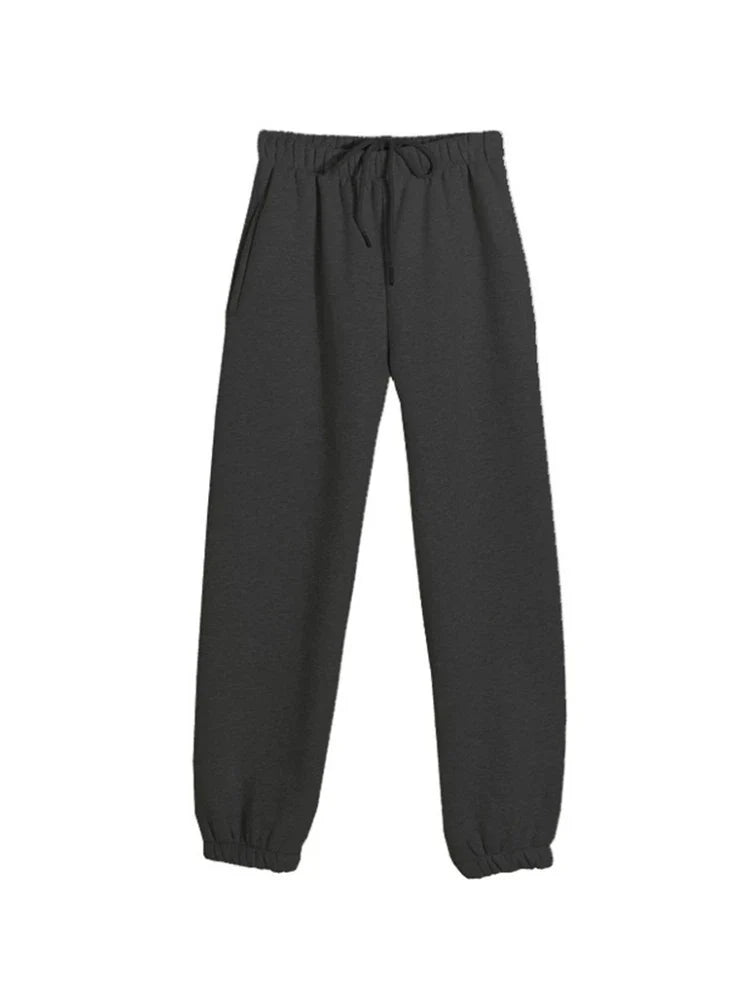 Women's casual black fleece tracksuit pants with elastic waistband and pockets.