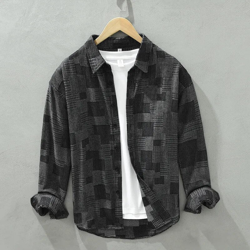 Men's vintage patch shirt with turn-down collar, long sleeves, and solid casual design in black.