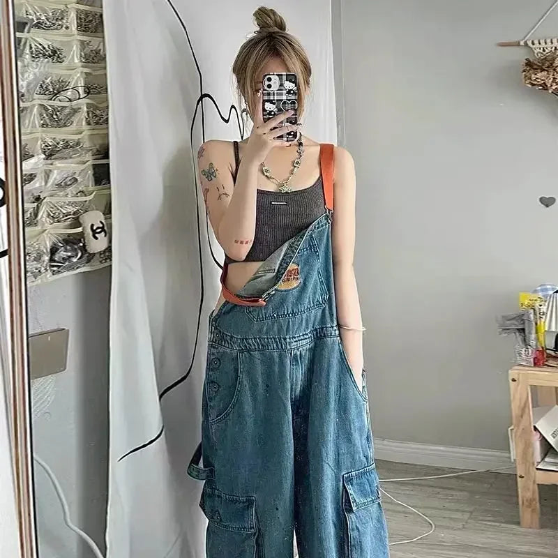 Cool Girl Style embroidered spicy ink denim strap jumpsuit for women, loose fit, full length, with pockets.