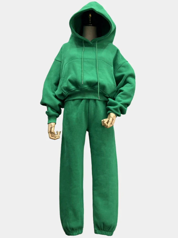 Women's green fleece hoodie and sweatpants tracksuit set, ideal for winter and spring casual wear.