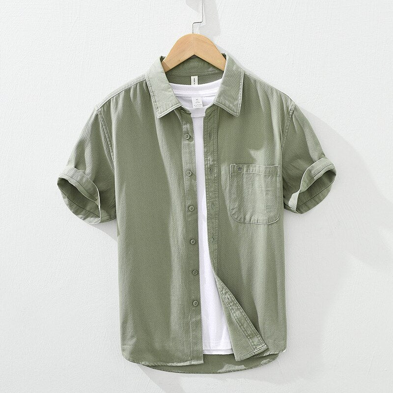 Men's green short sleeve cotton shirt with patch pockets and embroidery, casual summer top.