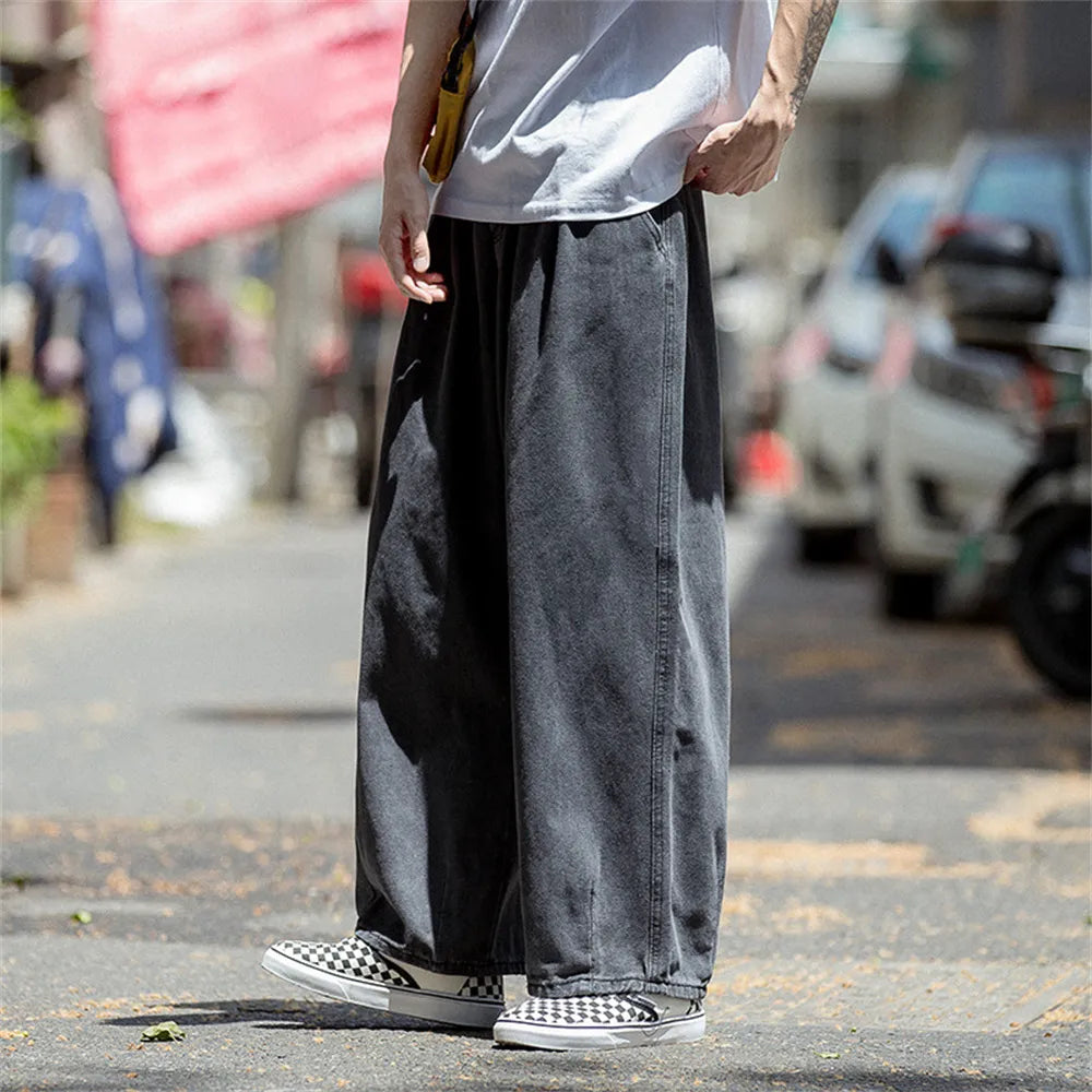 Men's wide leg denim cargo pants, loose straight baggy jeans for hip hop style.