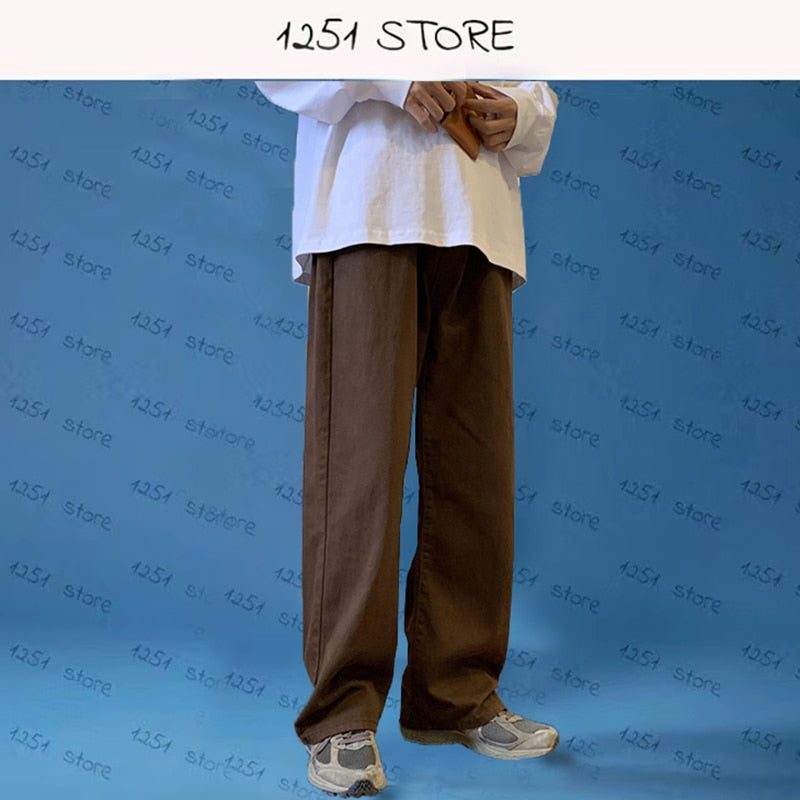 Wide brown denim trousers in streetwear style with midweight fabric, suitable for all genders and seasons.