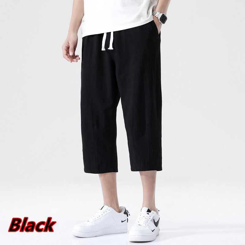 Men's black loose linen pants, nine-point length, Korean style with drawstring waist, summer casual wear.