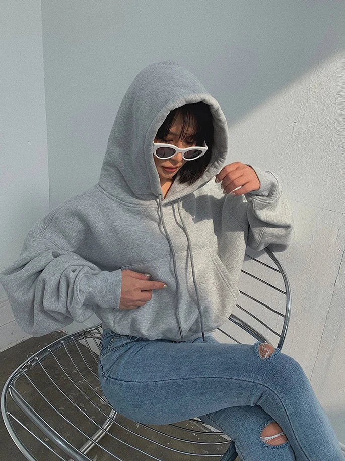 Women's grey fleece hoodie and jeans tracksuit set, casual and comfortable for winter and spring.