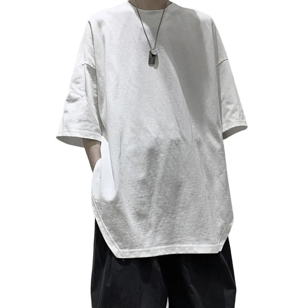 Men's oversized white Harajuku half sleeve T-shirt with round neck and side splits, ideal for casual daily wear in spring and summer.