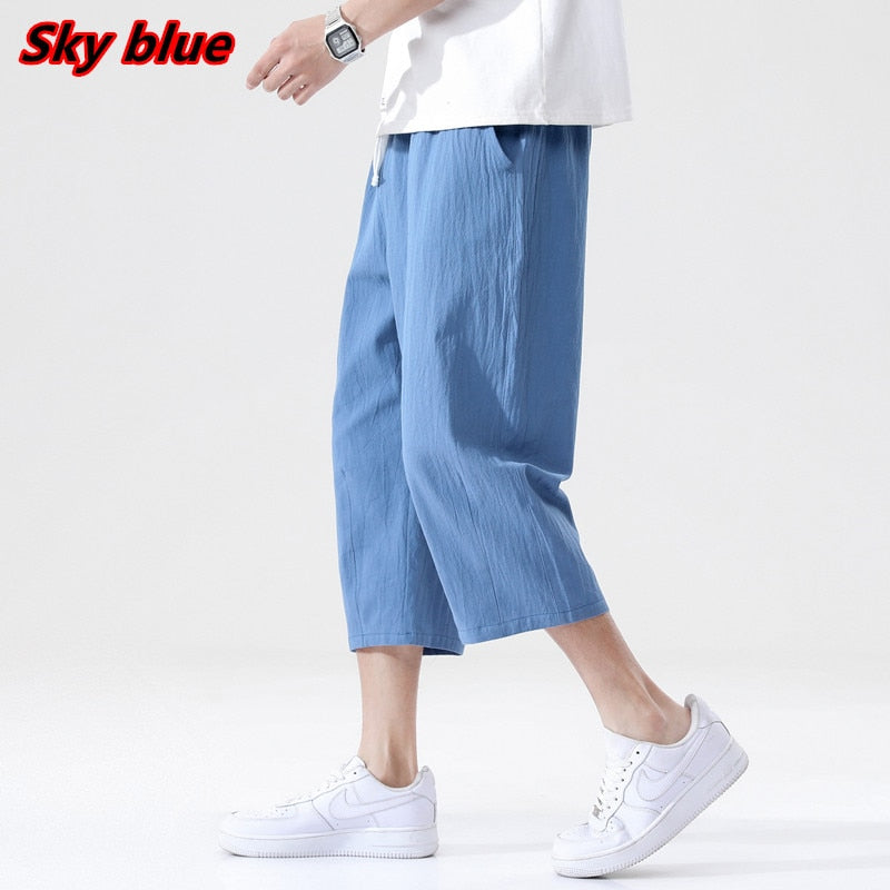 Men's sky blue linen loose pants, Korean style, knee-length, with drawstring waist.