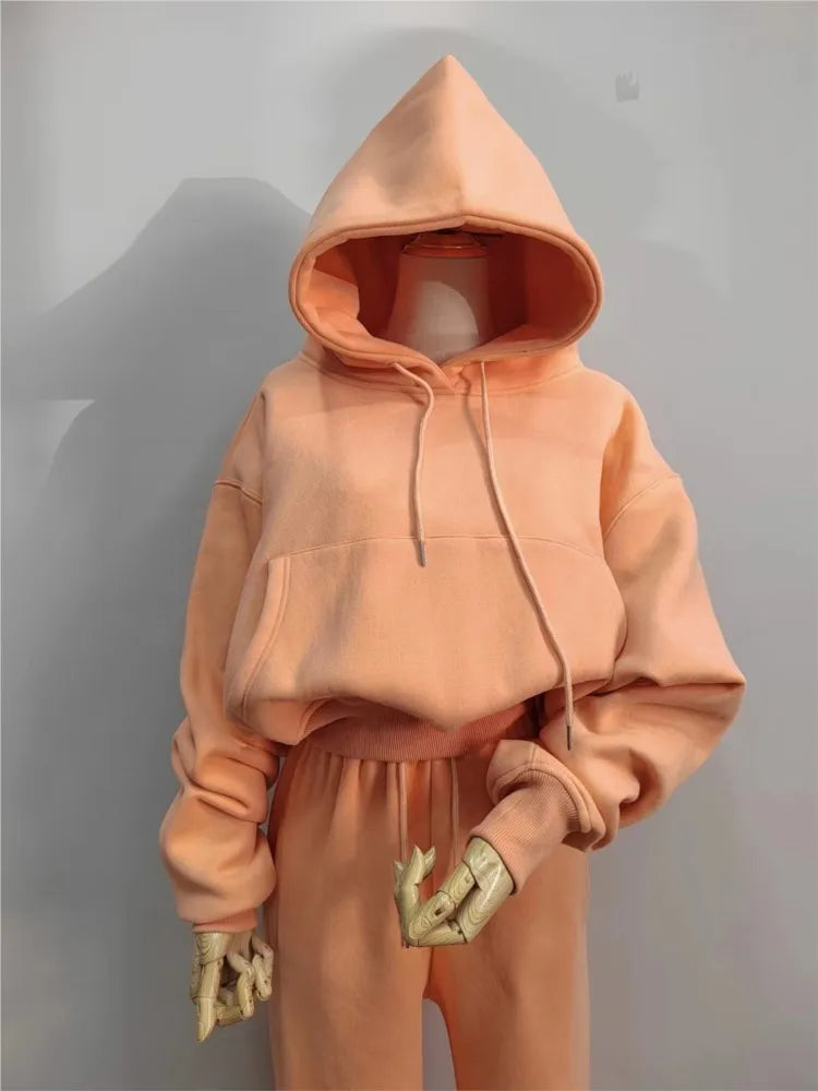 Women's solid color hoodies and sweatpants set, fleece tracksuit with pockets, for winter and spring casual wear.