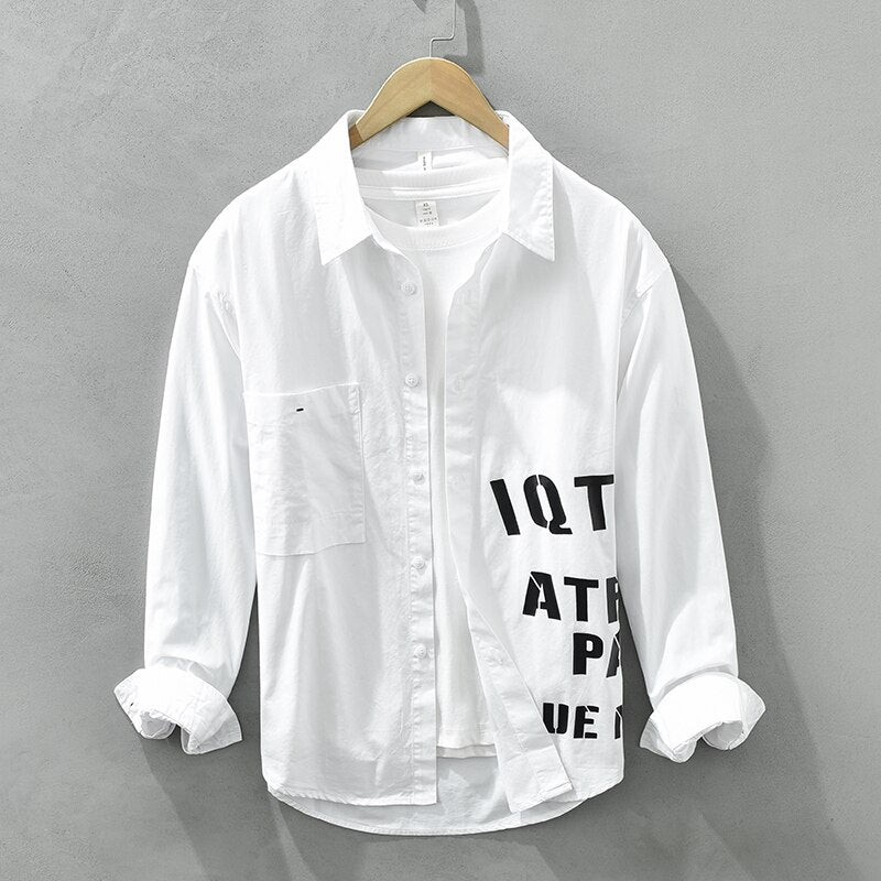 Men's casual long sleeve white cotton shirt with letter print and turn-down collar.