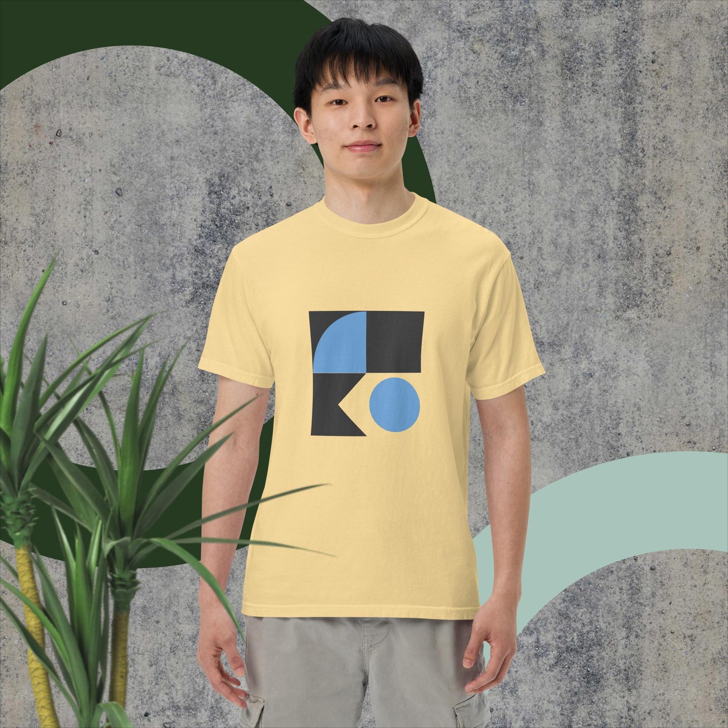 T1604 garment-dyed heavyweight unisex t-shirt, 100% ring-spun cotton, soft and breathable, relaxed fit, decorative design on yellow fabric.