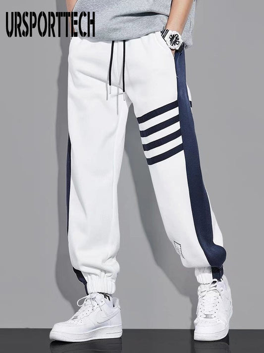 URSPORTTECH hip hop joggers, cargo men pants, techwear streetwear trousers, midweight, elastic waist, monochrome design.